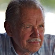 Older man with white hair and mustache